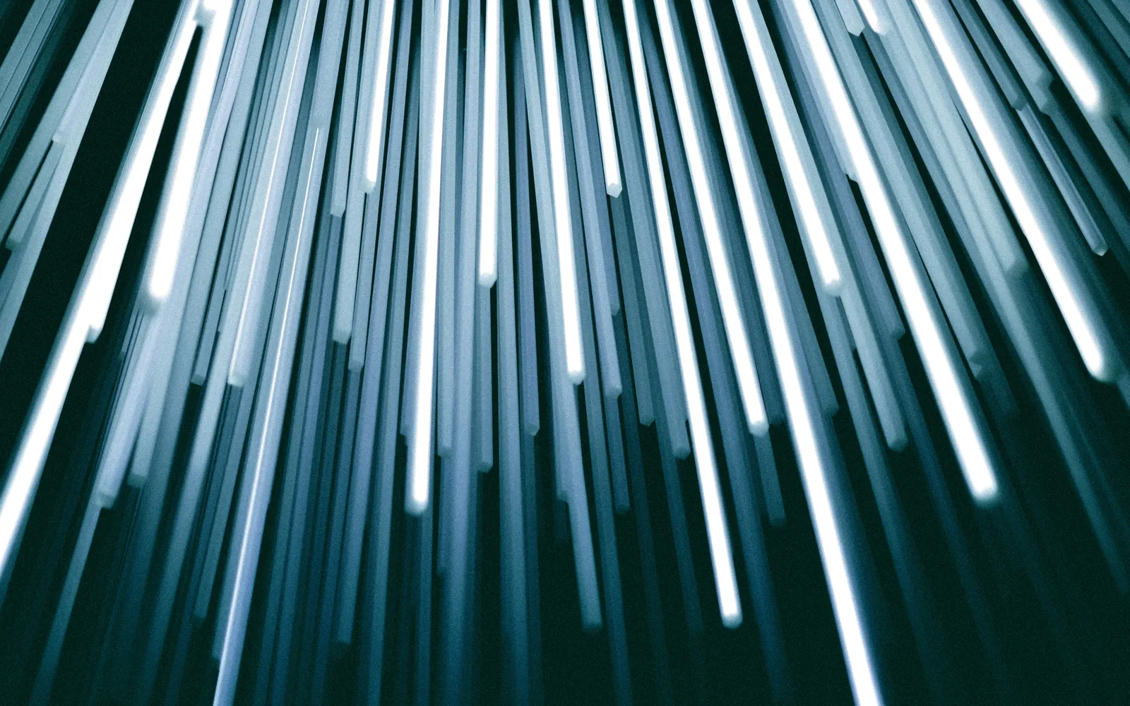 Streaks of teal light against a dark field